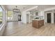 Open-concept living room flows into a bright kitchen area, featuring modern finishes and ample natural light at 2921 Moonlight Bay Ln, Las Vegas, NV 89128