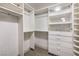 Organized walk-in closet with custom shelving, drawers, and ample storage space at 2921 Moonlight Bay Ln, Las Vegas, NV 89128