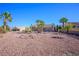 Lush backyard features a desert landscape with gravel and shrubbery at 3157 Faiss Dr, Las Vegas, NV 89134