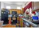 Efficient kitchen with warm wood cabinets, modern appliances, and a well-lit work area at 3157 Faiss Dr, Las Vegas, NV 89134