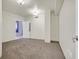 Bright bedroom with neutral carpet, light walls, and two entryways at 360 E Desert Inn Rd # 602, Las Vegas, NV 89109