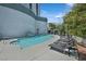 Relaxing pool area with lounge chairs, waterfall feature and lush landscaping at 360 E Desert Inn Rd # 602, Las Vegas, NV 89109