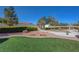 View of a backyard that features grass, trees, bushes and a pathway to a shed at 3716 N Torrey Pines Dr, Las Vegas, NV 89108