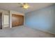 This bedroom features carpeted floors, a ceiling fan, and a closet at 3716 N Torrey Pines Dr, Las Vegas, NV 89108