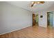 Cozy bedroom featuring hardwood floors, neutral walls, and multiple access doors for easy navigation at 3716 N Torrey Pines Dr, Las Vegas, NV 89108