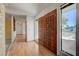 Warm foyer featuring hardwood floors, large double doors, and lots of natural light at 3716 N Torrey Pines Dr, Las Vegas, NV 89108