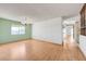 Expansive living room featuring hardwood floors, a decorative light fixture, and lots of natural light at 3716 N Torrey Pines Dr, Las Vegas, NV 89108