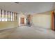 Spacious living room featuring a brick fireplace, and an open floor plan at 3716 N Torrey Pines Dr, Las Vegas, NV 89108