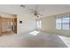 This living room features carpeted floors and several windows allowing natural light at 3716 N Torrey Pines Dr, Las Vegas, NV 89108