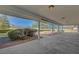 A spacious covered patio provides outdoor living space with views of the landscaped backyard at 3716 N Torrey Pines Dr, Las Vegas, NV 89108