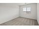 Cozy bedroom with neutral walls, carpet, and a window with outside views at 4203 Gold Desert St, North Las Vegas, NV 89032