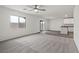 Spacious living room with carpet, sliding glass door to the outside, and bright natural light at 4203 Gold Desert St, North Las Vegas, NV 89032