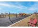 Community playground area includes swings, a play structure with slides, and picnic tables under a covered pavilion at 4203 Gold Desert St, North Las Vegas, NV 89032