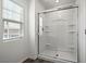 Modern bathroom with a glass-enclosed shower and built-in shelving at 4223 Gold Desert St, North Las Vegas, NV 89032