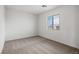 Bright bedroom with neutral carpet and a window offering pleasant outdoor views at 4223 Gold Desert St, North Las Vegas, NV 89032