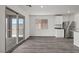 Dining area with wood floors and sliding glass doors leading to the outdoor space at 4223 Gold Desert St, North Las Vegas, NV 89032