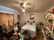 Bedroom featuring a cozy bed and vintage fan at 4312 Alpine Pl, Las Vegas, NV 89107