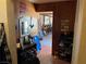 Hallway leading to the living room, featuring unique wall decor and tile flooring at 4312 Alpine Pl, Las Vegas, NV 89107