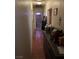 Hallway leading to bathroom, featuring tile flooring and neutral wall tones at 4312 Alpine Pl, Las Vegas, NV 89107