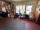 Comfortable living room with abundant natural light from the expansive windows at 4312 Alpine Pl, Las Vegas, NV 89107