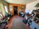 Cozy living room with wood paneling, neutral color and a vintage patterned rug at 4312 Alpine Pl, Las Vegas, NV 89107