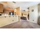 Open concept shows the kitchen flows into the living area creating an inclusive space for gatherings at 4425 Woodpine Dr # 104, Las Vegas, NV 89119