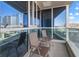 Outdoor balcony with seating and views of the surrounding buildings and parking lot at 4575 Dean Martin Dr # 505, Las Vegas, NV 89103