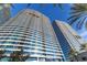 Modern high rise building with blue tinted window paneling and balconies at 4575 Dean Martin Dr # 505, Las Vegas, NV 89103