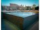 Close-up of a mosaic-tiled hot tub on an outdoor deck with lounge chairs at 4575 Dean Martin Dr # 505, Las Vegas, NV 89103