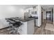 Open-concept kitchen with a breakfast bar and stainless steel appliances at 4575 Dean Martin Dr # 505, Las Vegas, NV 89103