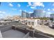 View of buildings, parking lot, and palm trees set against a vibrant blue sky at 4575 Dean Martin Dr # 505, Las Vegas, NV 89103