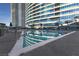 Outdoor pool with surrounding buildings reflecting in the water at 4575 Dean Martin Dr # 505, Las Vegas, NV 89103