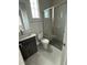 Modern bathroom featuring a glass shower, sleek vanity, and a toilet with a window view at 4630 Blushing Dawn Ave, Las Vegas, NV 89118