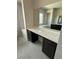 Bathroom vanity featuring a large mirror, drawers and cabinets with a marble countertop at 4630 Blushing Dawn Ave, Las Vegas, NV 89118