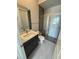 This bathroom features a modern vanity, toilet and shower at 4630 Blushing Dawn Ave, Las Vegas, NV 89118