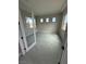 Bright bedroom featuring neutral walls, recessed lighting, and modern tiled floors at 4630 Blushing Dawn Ave, Las Vegas, NV 89118