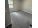 This bedroom has neutral walls, carpet, and a bright window at 4630 Blushing Dawn Ave, Las Vegas, NV 89118