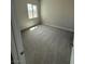 Carpeted bedroom with a bright window, offering a comfortable and relaxing space at 4630 Blushing Dawn Ave, Las Vegas, NV 89118