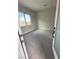 Cozy bedroom with large window, plush carpet, and neutral color scheme at 4630 Blushing Dawn Ave, Las Vegas, NV 89118