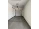 This garage features a concrete floor and an automatic door at 4630 Blushing Dawn Ave, Las Vegas, NV 89118
