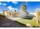 Backyard view featuring a covered patio, artificial grass, and a storage shed at 4666 Amberwood Ln, Las Vegas, NV 89147