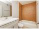 A well-lit bathroom with a tiled shower and a modern white vanity at 4666 Amberwood Ln, Las Vegas, NV 89147