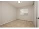 Bedroom featuring plush neutral carpet, window, and closet with sliding doors at 4666 Amberwood Ln, Las Vegas, NV 89147