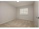 Bedroom featuring neutral carpet, a window, and light colored walls at 4666 Amberwood Ln, Las Vegas, NV 89147