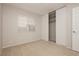 Cozy bedroom with neutral carpet, a window, and a closet with sliding doors at 4666 Amberwood Ln, Las Vegas, NV 89147