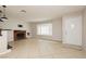 Bright living room with tile floors, a brick fireplace, and a front door at 4666 Amberwood Ln, Las Vegas, NV 89147