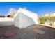 Exterior view of the white storage shed in the backyard at 4666 Amberwood Ln, Las Vegas, NV 89147