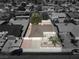 Expansive aerial view of a single-story home showcasing the roof, driveway, and neighboring houses in a residential area at 4816 Greencreek Dr, Las Vegas, NV 89110