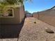 Gravel backyard enclosed by walls, offering ample space and privacy at 4816 Greencreek Dr, Las Vegas, NV 89110