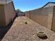 Spacious gravel backyard with a block wall and a small dead patch of grass at 4816 Greencreek Dr, Las Vegas, NV 89110